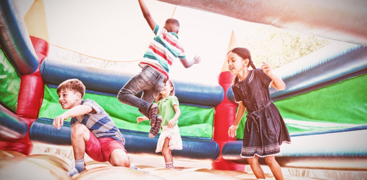 Kids on a bouncy house castle