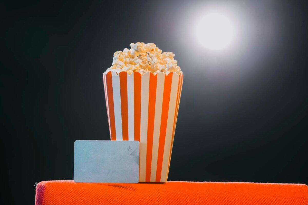 popcorn in spotlight on armchair  at a cinema to represent hybrid genre 