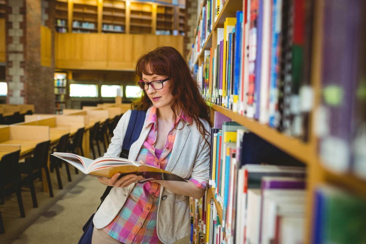 mature student reading in a library