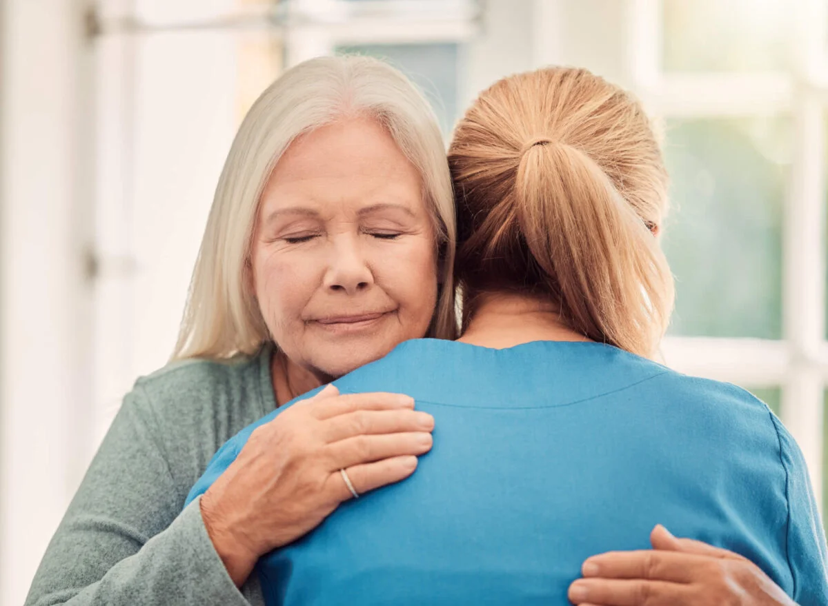 Two ladies hugging to show compassion and empathy
