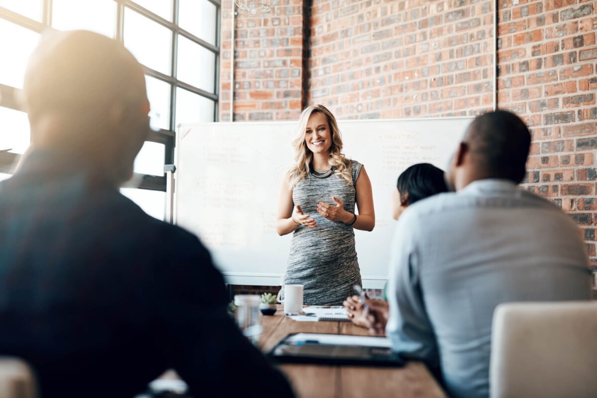 businesswoman presenting a meeting in a boardroom