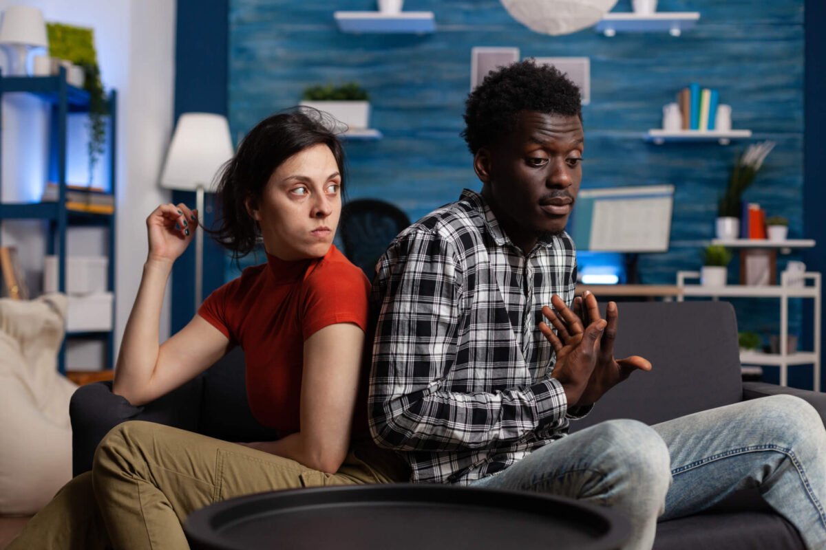 Young couple having an argument back to back