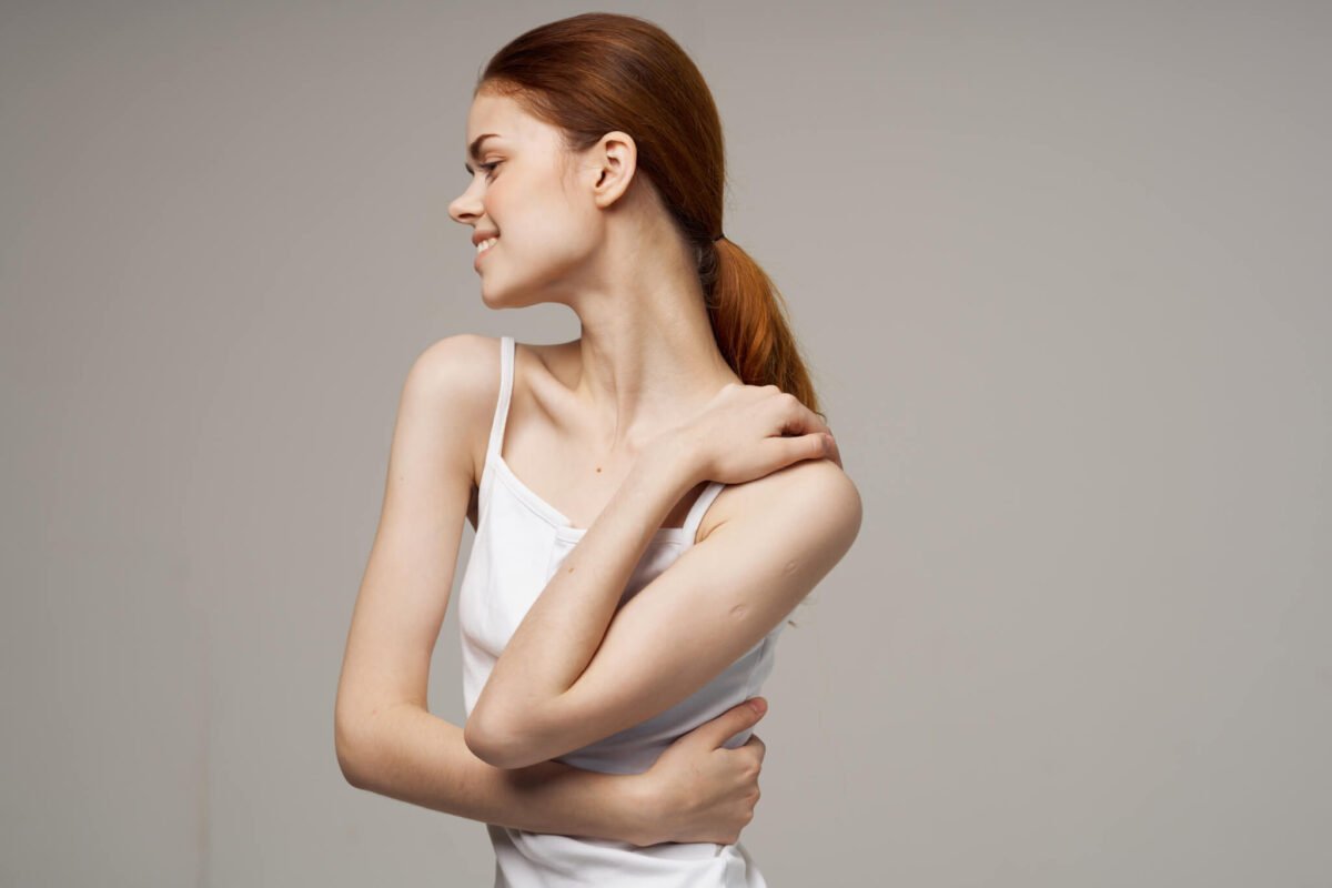 Woman with joint pain and sore neck representing ehlers-danlos syndrome 