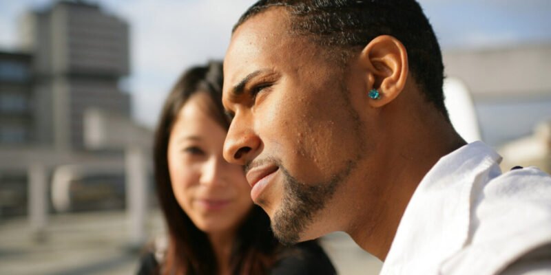 Woman trying to talk to her unresponsive boyfriend who is coming out as autistic