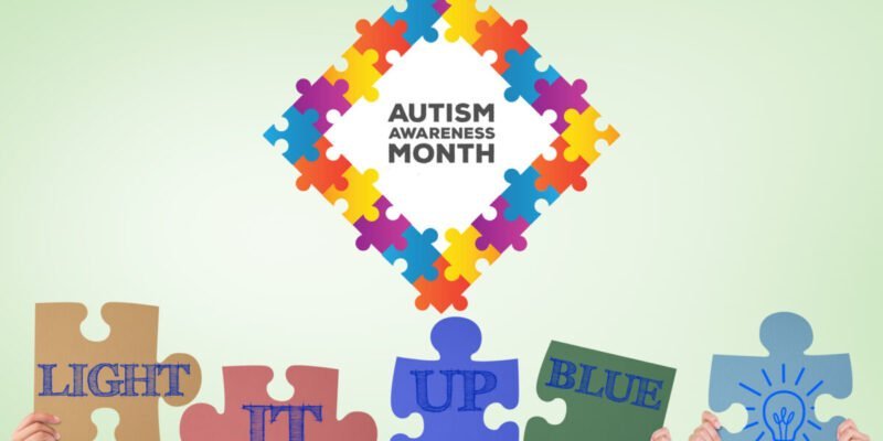 autism puzzle piece for autism awareness month with hands holding up the words light it up blue