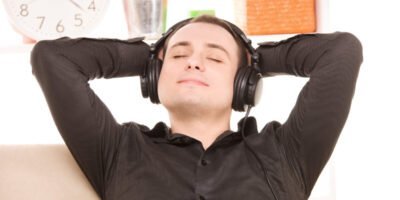bright picture of happy man with noise canceling headphones