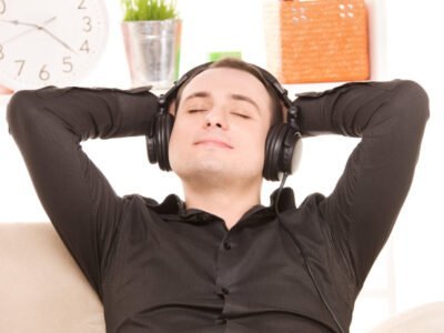 bright picture of happy man with noise canceling headphones