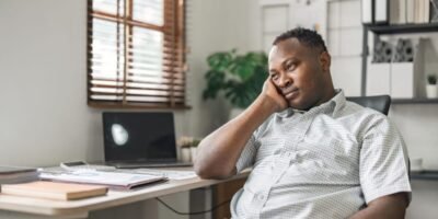 black businessman stressed bored and overthinking
