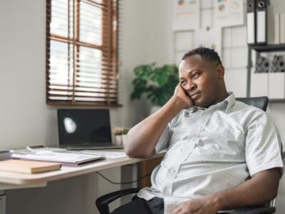 black businessman stressed bored and overthinking