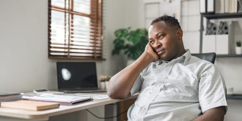 black businessman stressed bored and overthinking