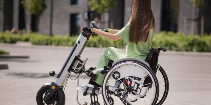 Woman using a portable mobility scooter on the street