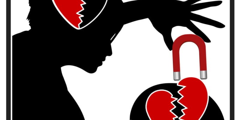 silhouette of narcissistic mother pulling heart out of child's brain with magnet to symbolise pain