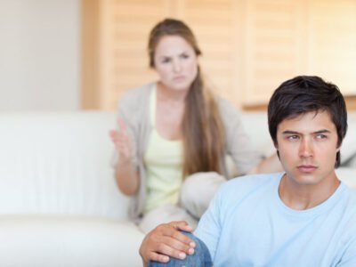 upset adhd couple arguing. woman is arguing at man who has rejection sensitive dysphoria