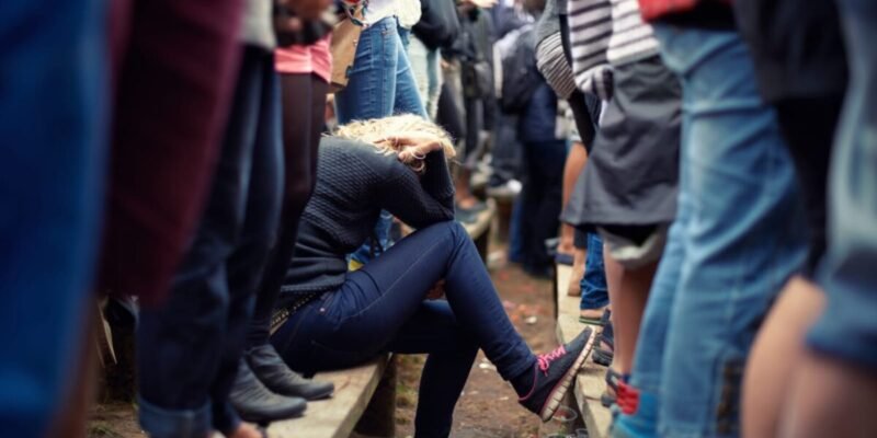 social anxiety girl with head in hands