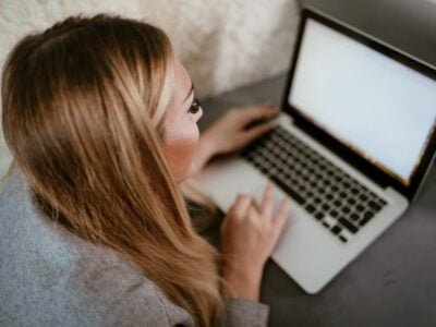 girl creating social media content on laptop